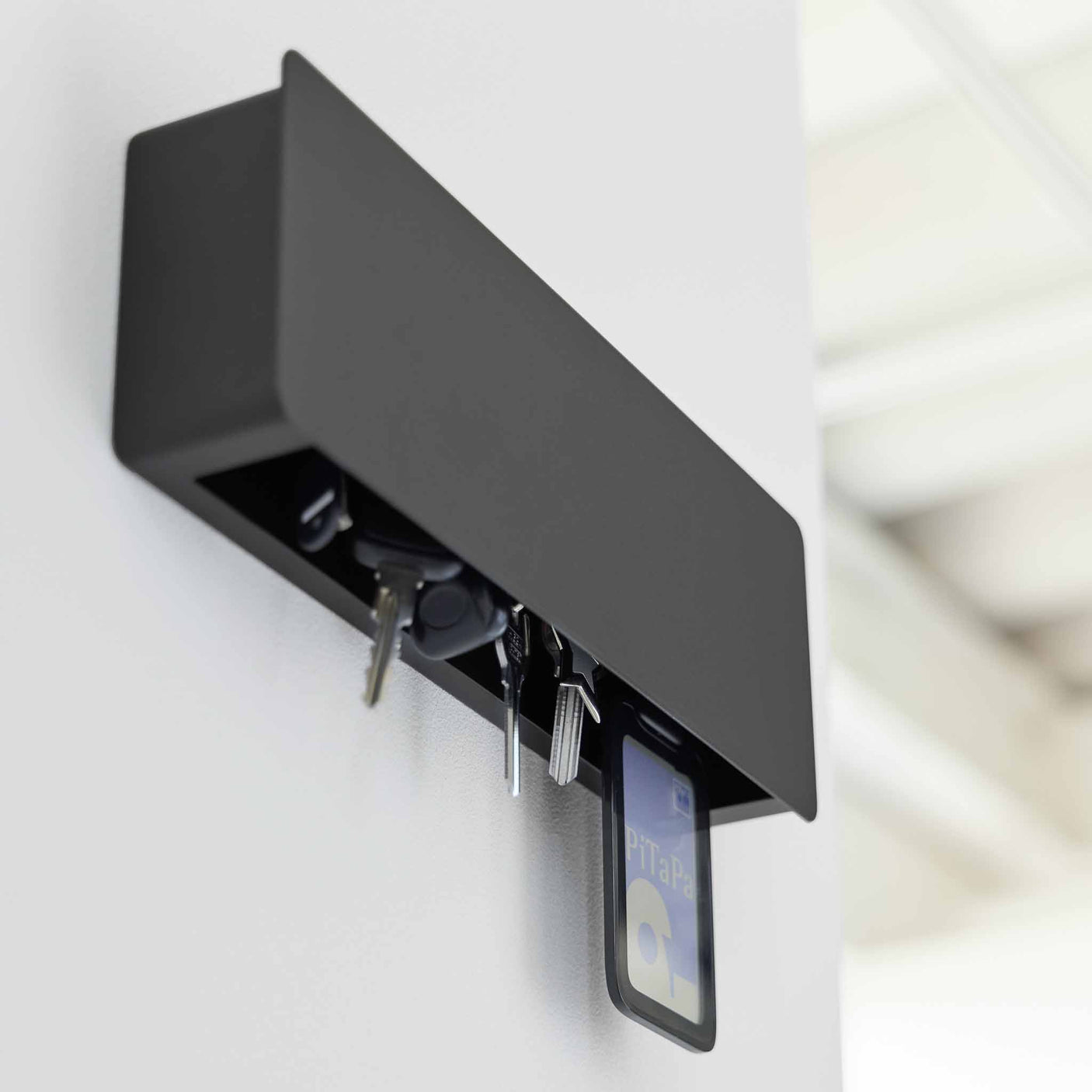 Moderne nøkkelskap i teksturert matt sort til hjem og kontor