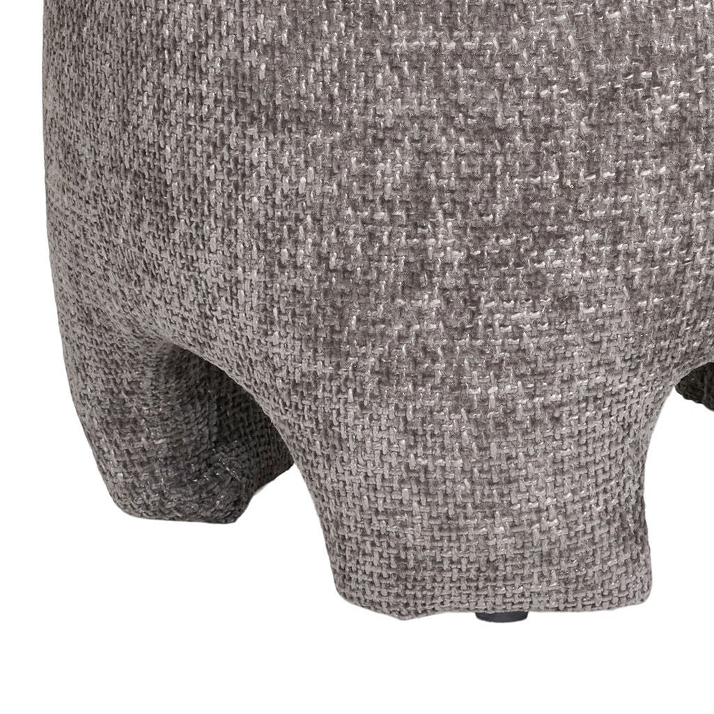 Grå puff med avrundet form og dekorativt design