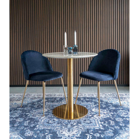 Detaljbilde av Geneve spisestol i blå velur – mykt og eksklusivt sete med høy komfort.