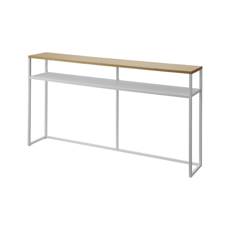 Hvit konsollbord med treplate og hylle i lys stue.