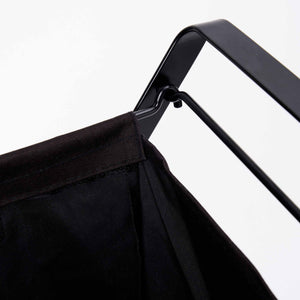 Detaljbilde av stålramme på sammenleggbar vaskekurv