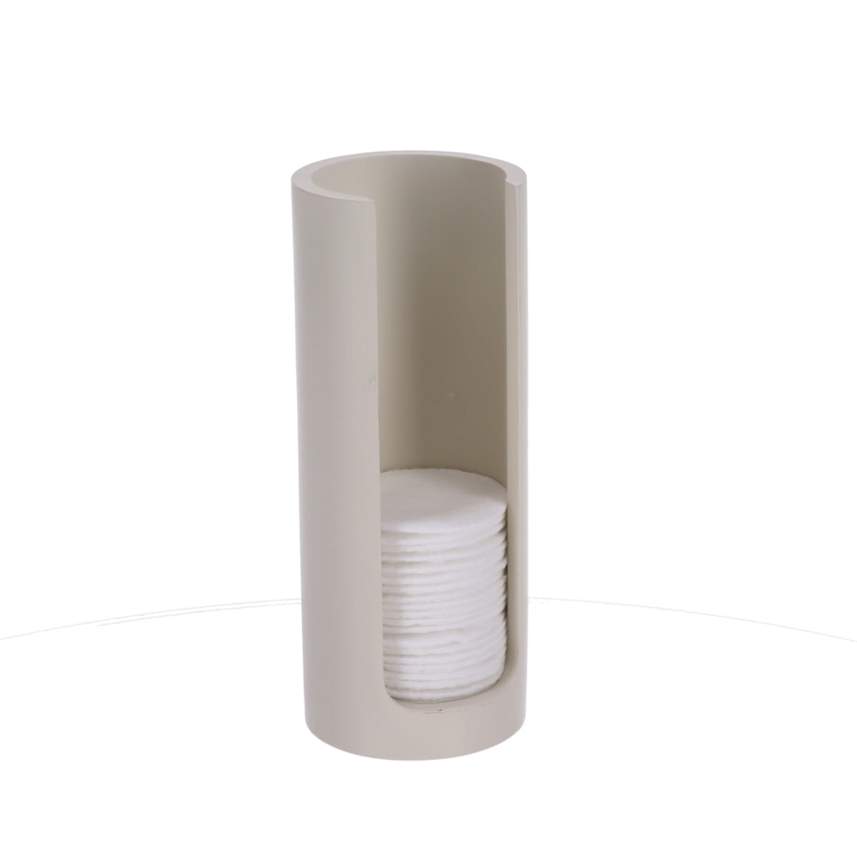 Beige bomuldspadsdispenser stylet på en badeværelseshylle