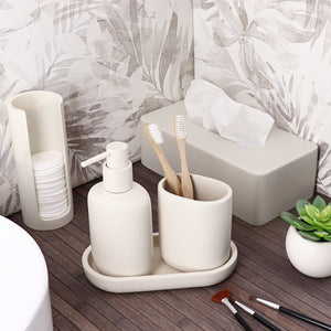 Smal beige dispenser til bomuldspads set fra siden