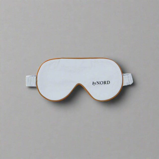 Lys blå sovemaske i myk bomull med elastisk stropp.