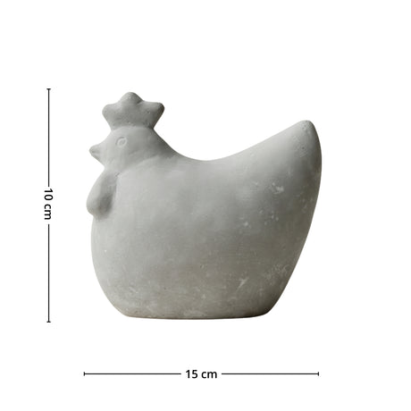 DBKD betonghøne plassert i nordisk hageinteriør med planter og naturlige materialer.

