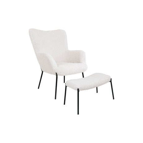 Loungestol og fotskammel i hvit teddy som gir rommet en lun sitteplass