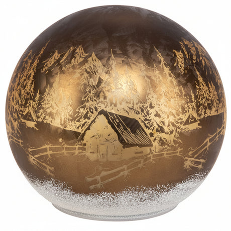 Lysende kulelampe med motiv av fjellhytte omgitt av trær og fjell.