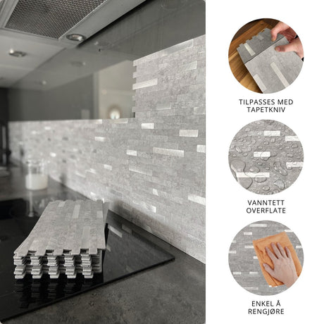 Selvklebende EasyTiles Pro fliser montert som backsplash på kjøkkenvegg, grå stein-look, med stabel av fliser foran. Viser at flisene kan tilpasses med tapetkniv, er vanntette og enkle å rengjøre.