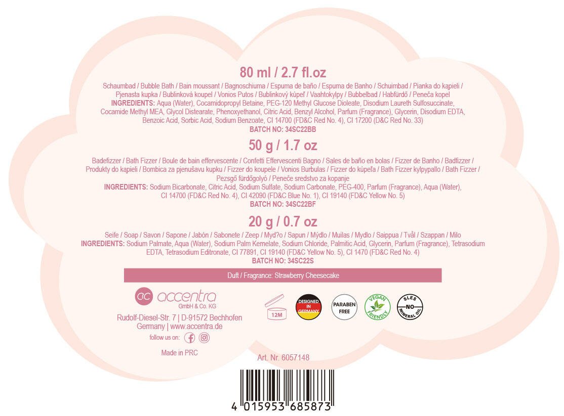 Bakside av rosa gavesett formet som en prinsessevogn, med produktinformasjon, ingrediensliste og strekkode.
